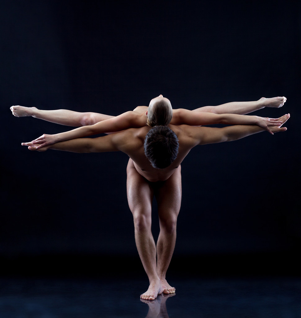 Image of two naked acrobats showing trick - Photo, Image