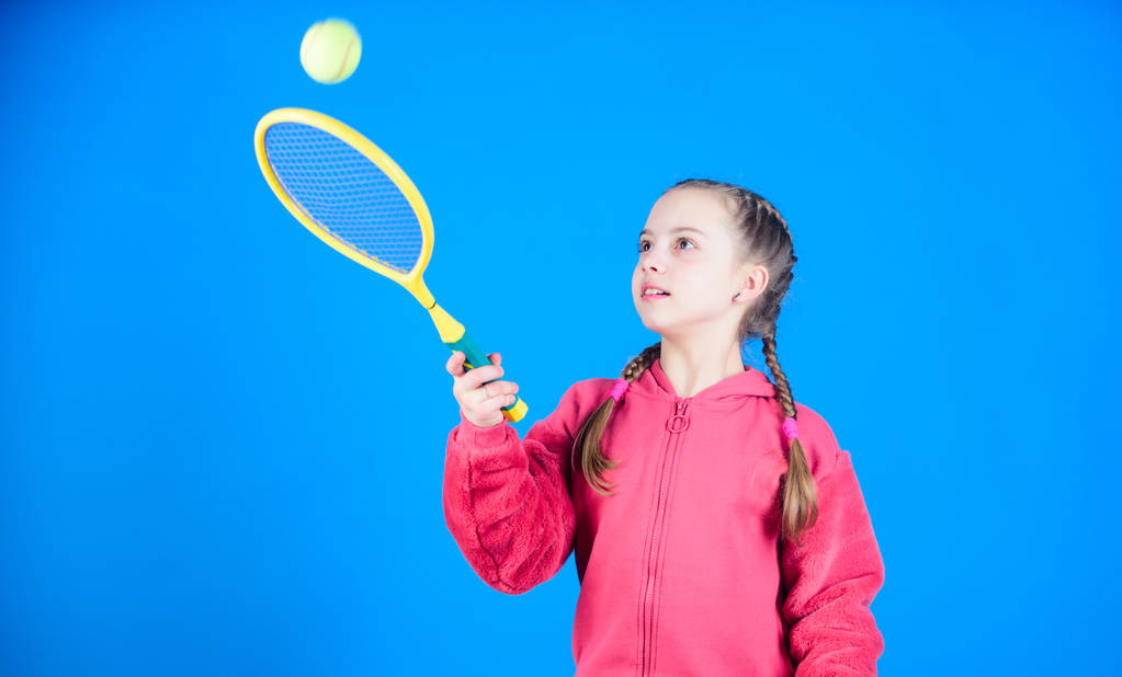 Tennis player with racket and ball. Childhood activity. Happy child play tennis. Gym workout of teen girl. Little girl. Fitness diet brings health and energy. Sport game activity. happy childhood - Photo, Image