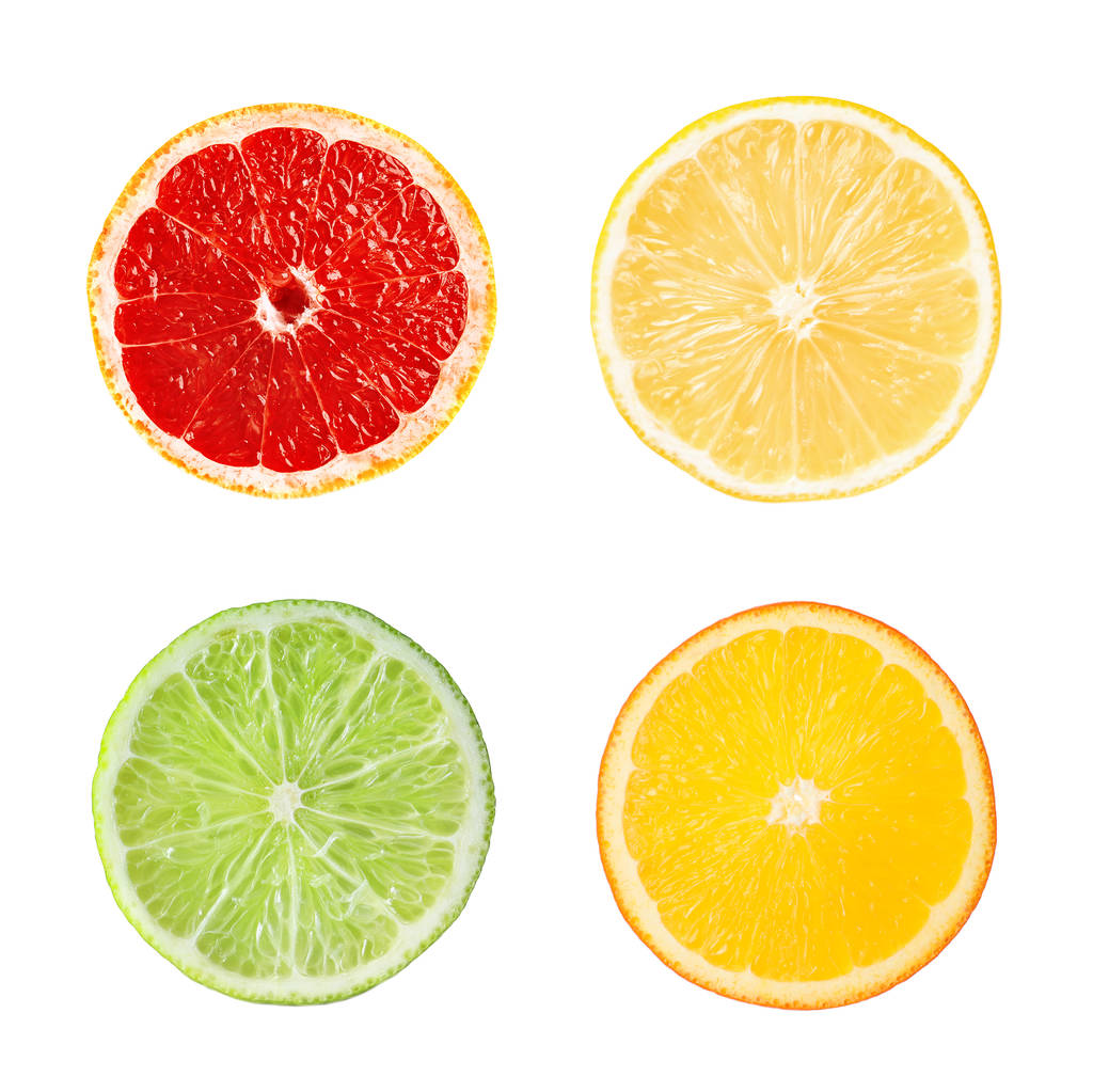 白い背景に、トップ ビューで異なる新鮮な熟した柑橘系の果物のスライスを設定します。  - 写真・画像