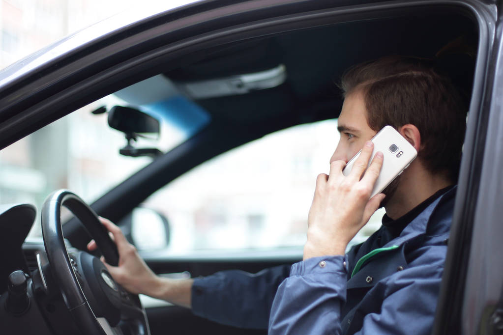 successful man talking on mobile phone in the car - Photo, Image
