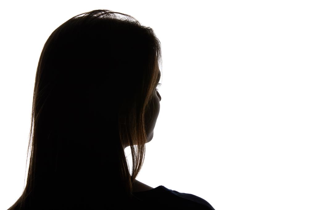 Sziluettje fiatal nő látszó el elszigetelt fehér - Fotó, kép