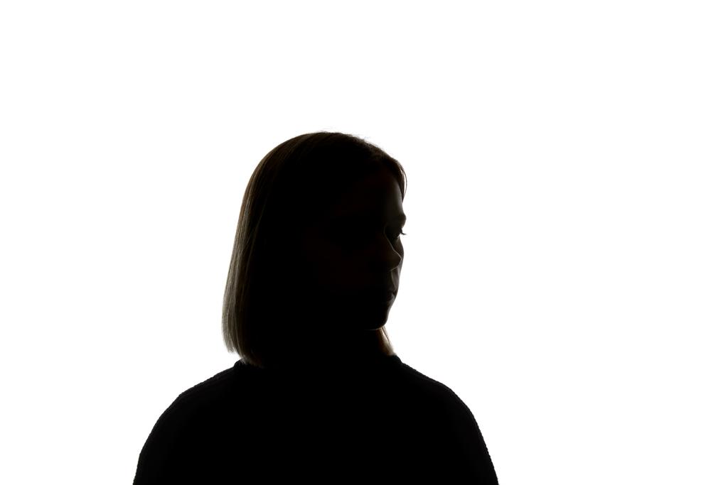 Silhouette einer Frau, die isoliert auf Weiß wegschaut - Foto, Bild