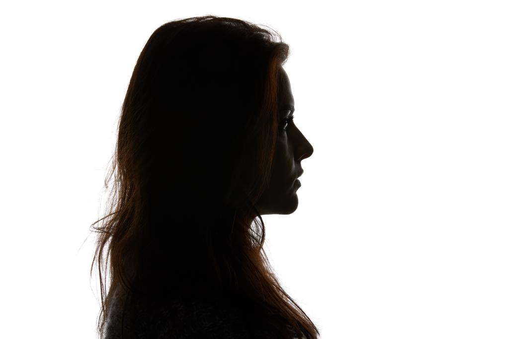 Πλευρική όψη της γυναίκας που κοιτάζει μακριά απομονωμένη σε λευκό - Φωτογραφία, εικόνα