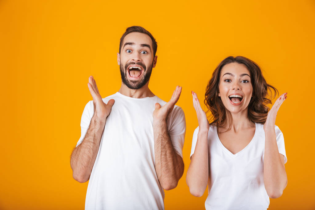 Image of delighted people man and woman in basic clothing wonder - Photo, Image