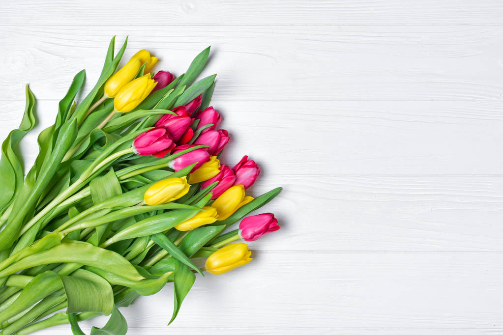 Beautiful fresh yellow and pink tulips bouquet on white - Photo, Image