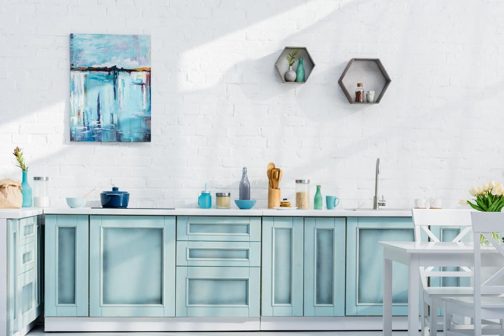 interior of bright elegant kitchen with kitchenware, decor and sunlight - Photo, Image