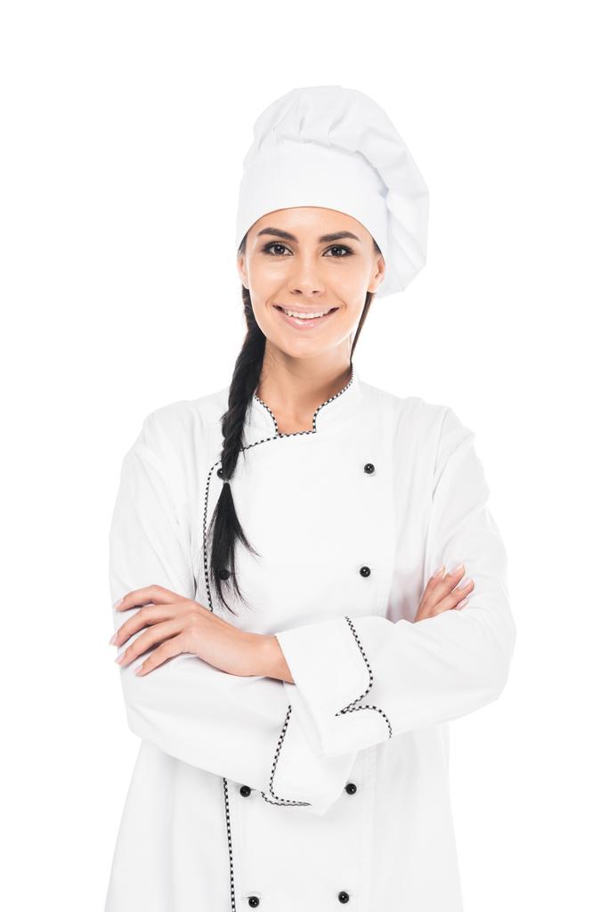 Uśmiechnięty kucharz w jednolite stojący z skrzyżowanymi rękami na białym tle - Zdjęcie, obraz