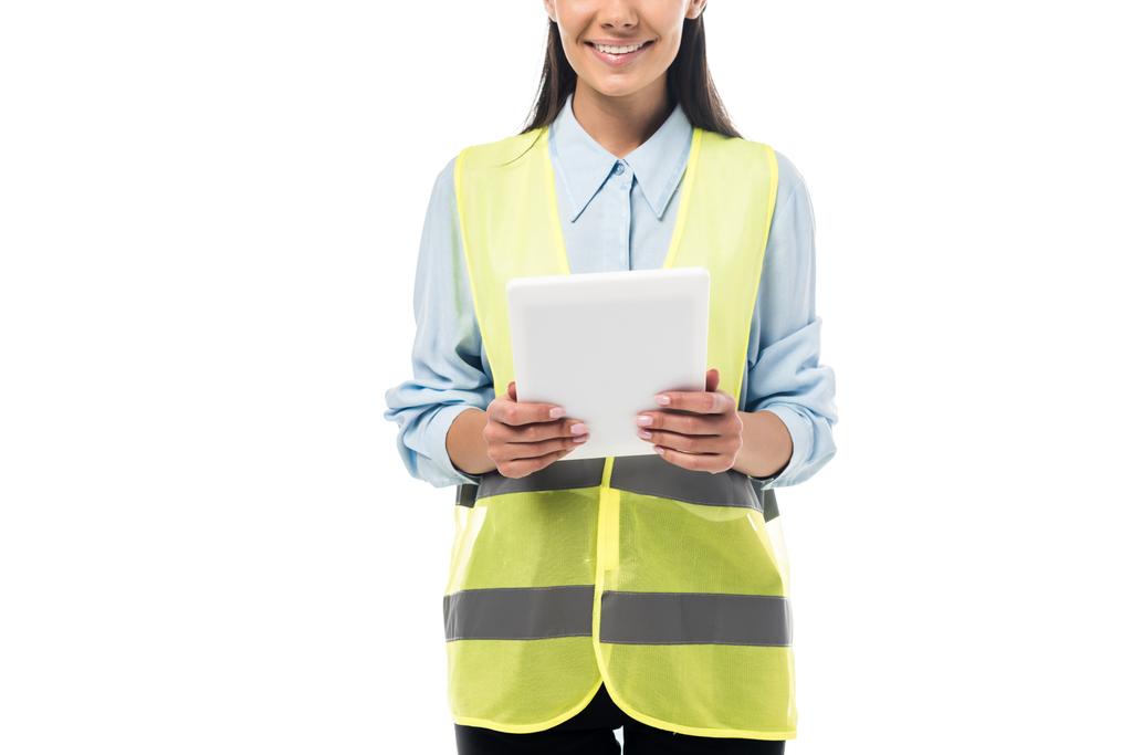 Cropped view of engineer in safety vest using digital tablet isolated on white - Photo, Image