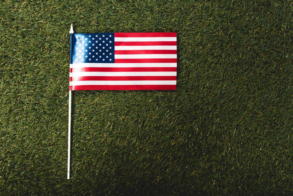 top view of american flag with stars and stripes on grass - Photo, Image