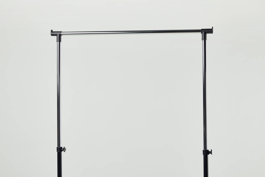 Black steel straight rack isolated on light grey - Photo, Image