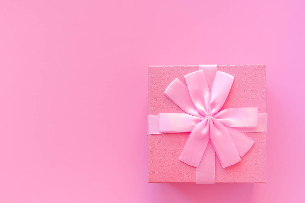 Cute pink gift box on pink background. - Photo, Image