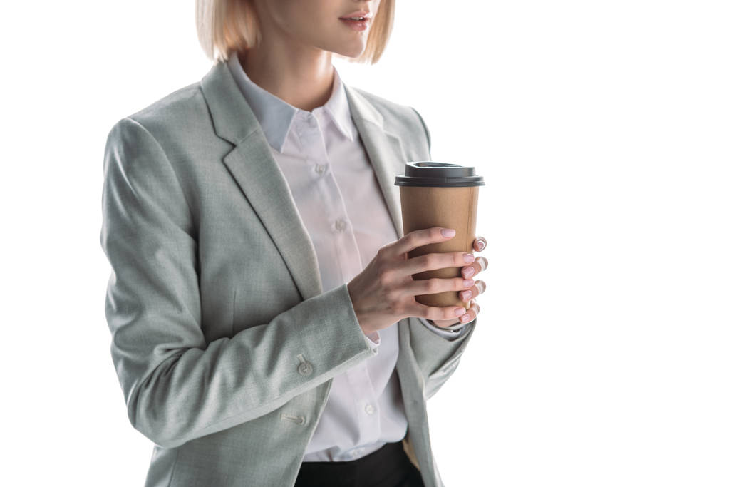 partial view of businesswoman holding coffee to go isolated on white - Photo, Image