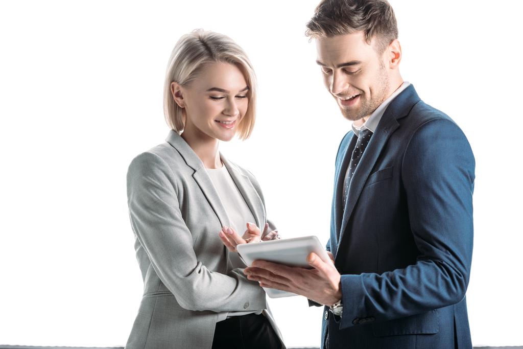 smiling young business partners using digital tablet isolated in white - Photo, Image