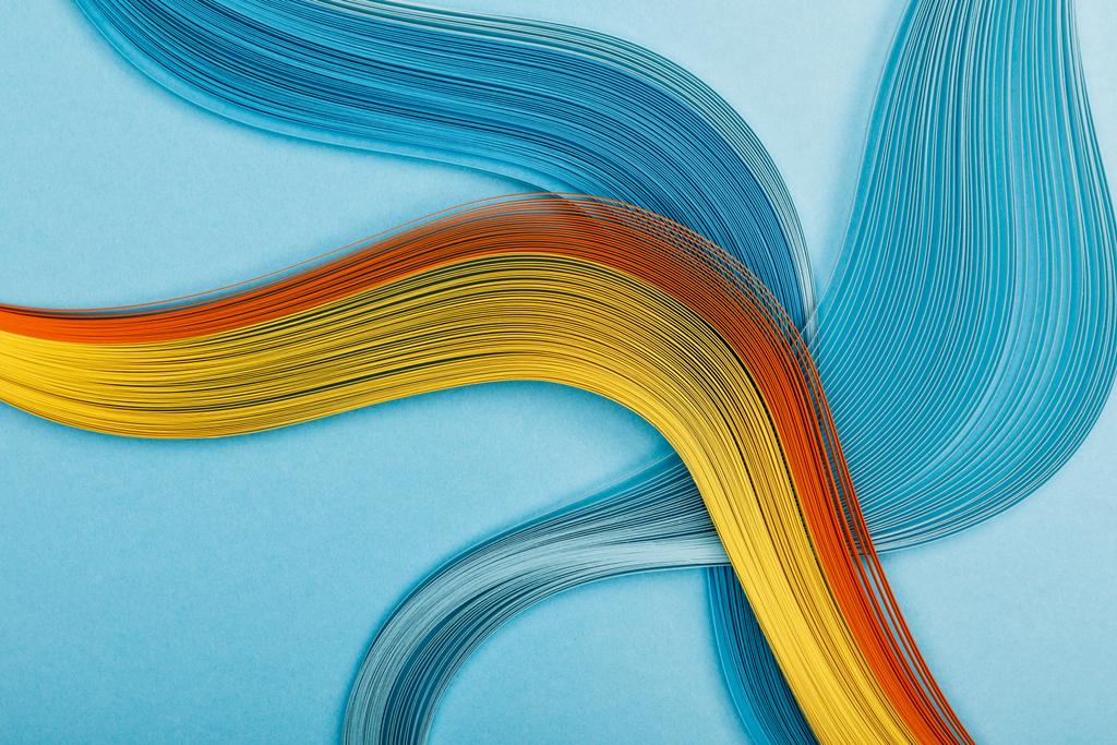 різнокольорові яскраві абстрактні лінії на синьому фоні
 - Фото, зображення