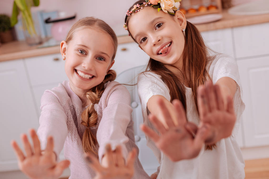 Charming teenagers stretching their hands to camera - Photo, Image