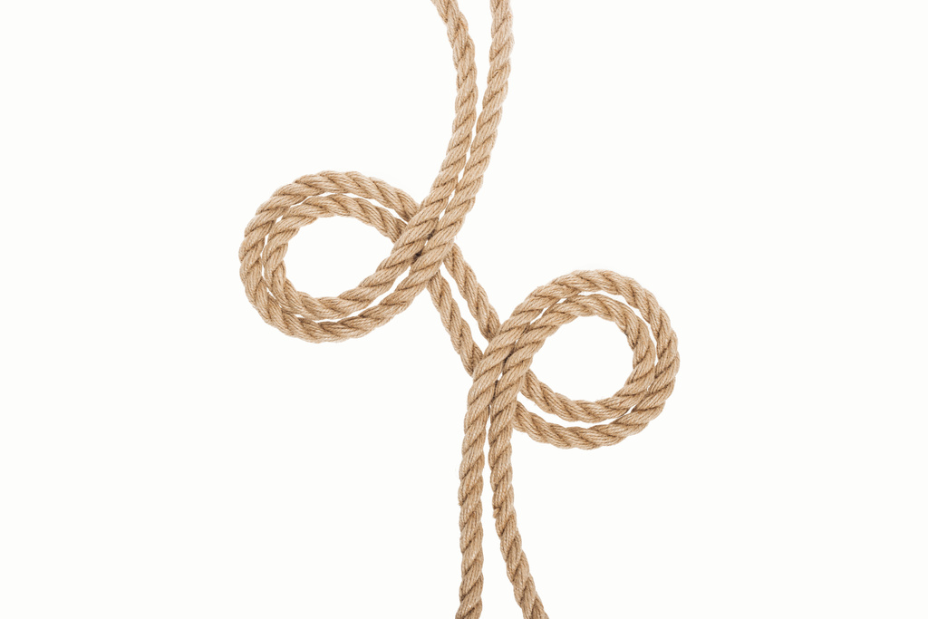закручені коричневі та джутові мотузки ізольовані на білому
  - Фото, зображення