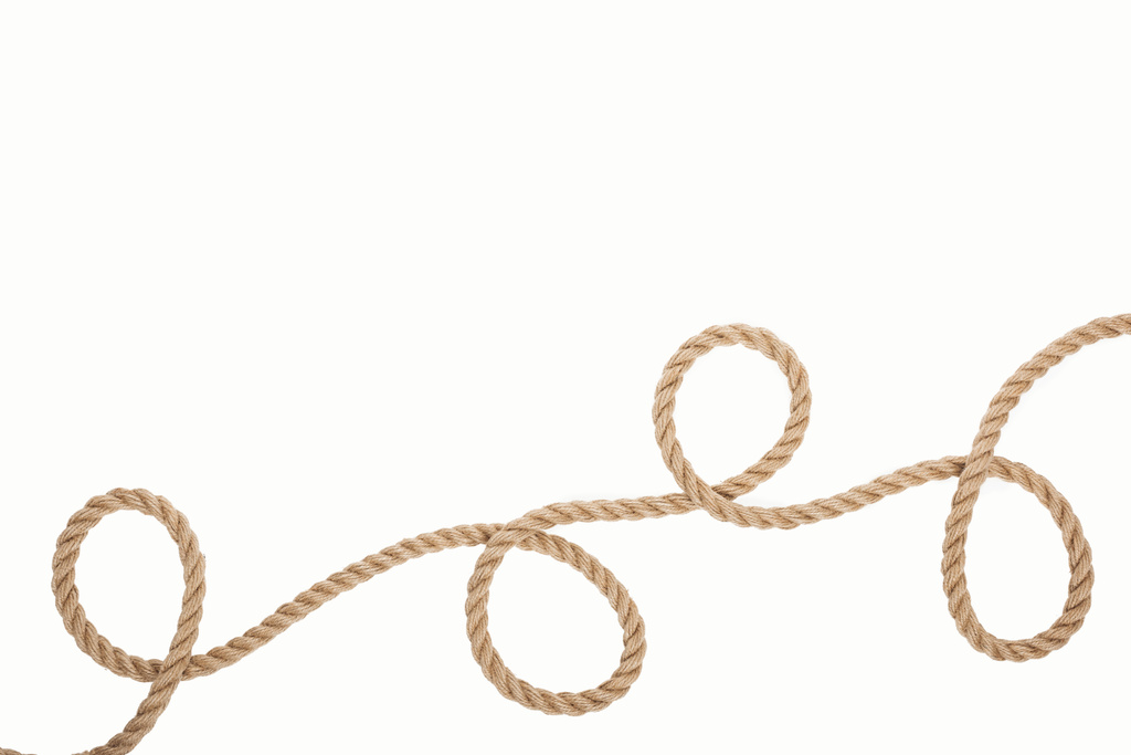 lange en bruine touw met krullen geïsoleerd op wit  - Foto, afbeelding