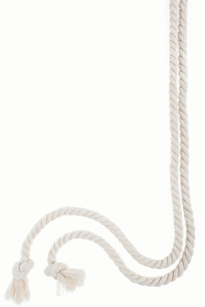 white long curled ropes with knots isolated on white - Photo, Image