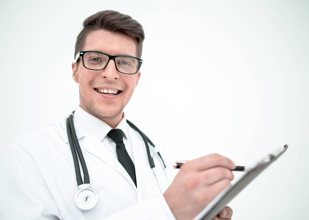 close up. smiling doctor writing a prescription
. - Фото, изображение