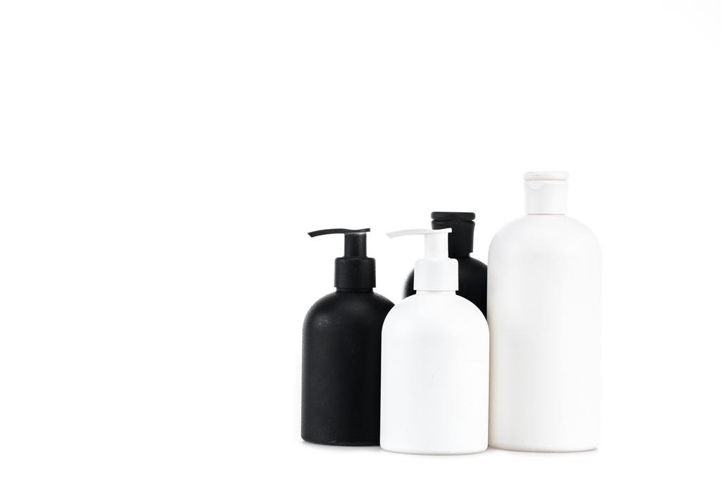 Black and white cosmetic bottles isolated on white - Photo, Image