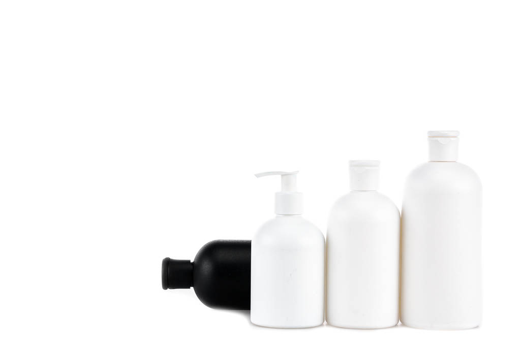 Чорно-білі косметичні пляшки ізольовані на білому
 - Фото, зображення
