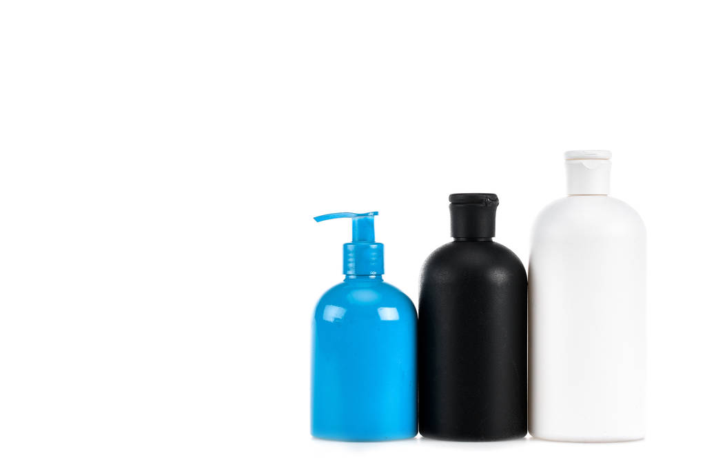 Tres botellas cosméticas con spray aislado en blanco
 - Foto, Imagen