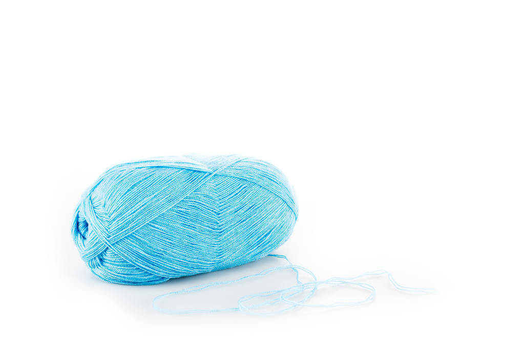 One blue yarn clew on white surface with copy space - Photo, Image