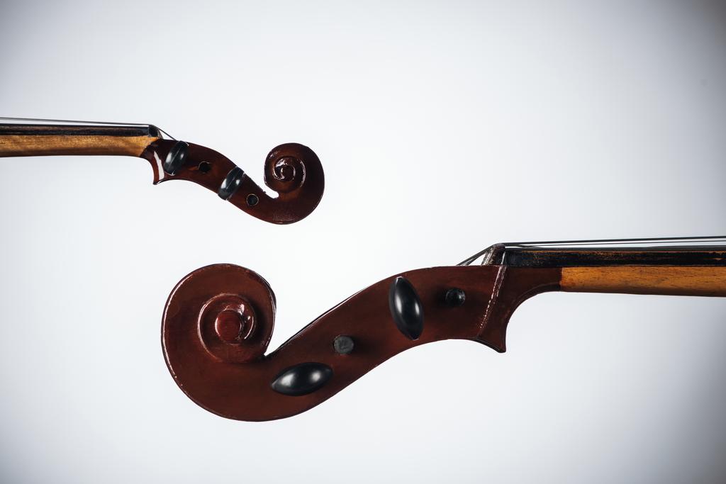close up of classic violoncello with bow on white background - Photo, Image