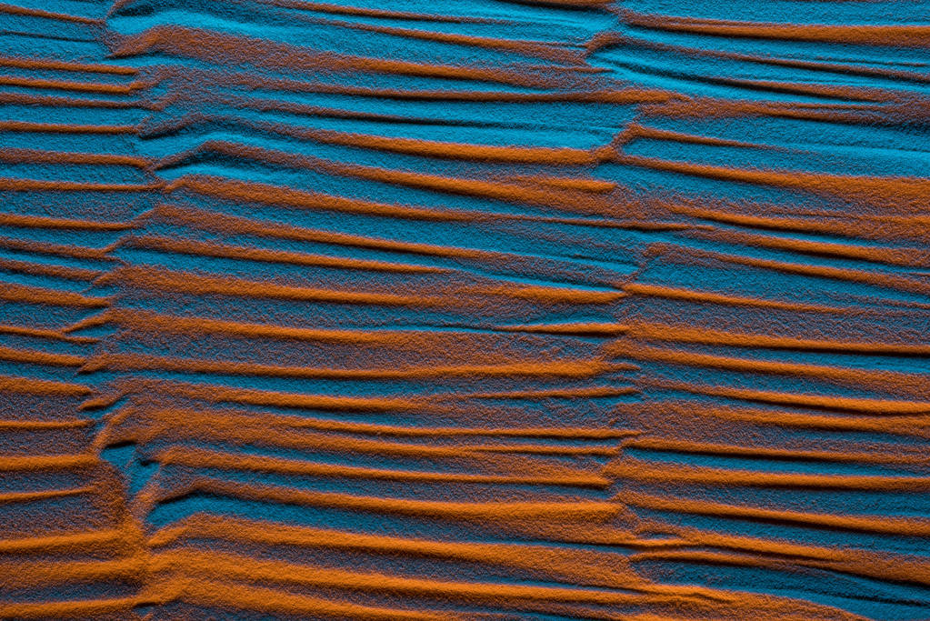 vista superior de fondo arenoso texturizado con filtro de color y ondas abstractas
 - Foto, imagen