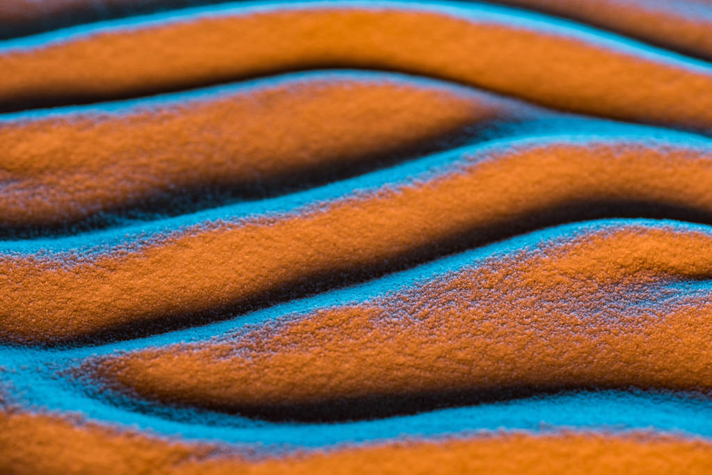 z bliska widok teksturowane piasku tła z fal i filtr kolorów - Zdjęcie, obraz
