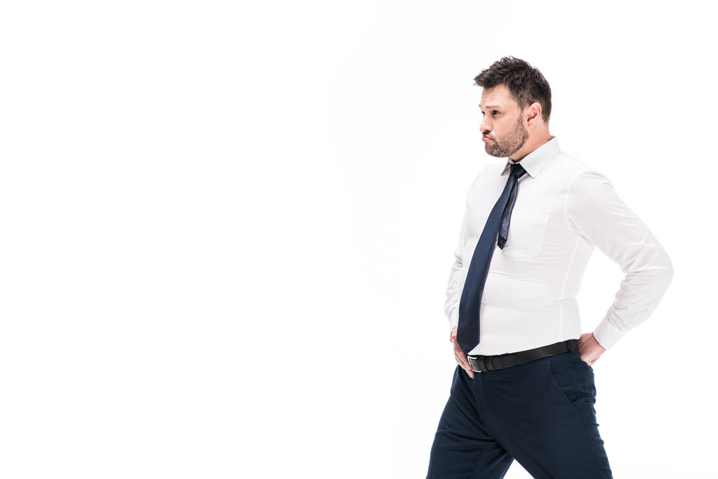 υπέρβαρο άνθρωπος σε σφιχτό επίσημο φθορά που παρουσιάζουν απομονωμένα σε λευκό με Φωτοχώρο - Φωτογραφία, εικόνα