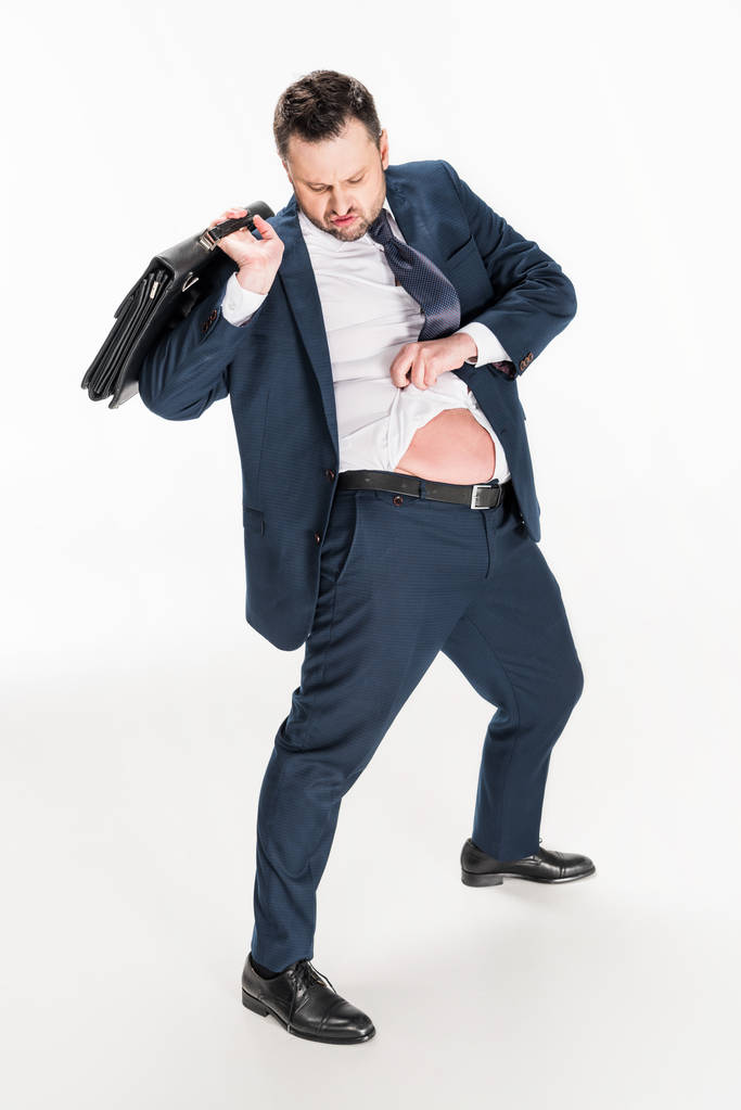 overgewicht zakenman in strakke formele slijtage met aktetas op wit - Foto, afbeelding
