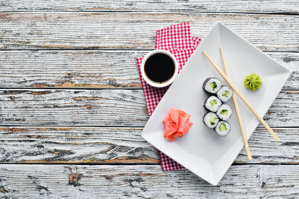 Vegetarian sushi roll with cucumber. Japanese cuisine. Top view. - Photo, Image