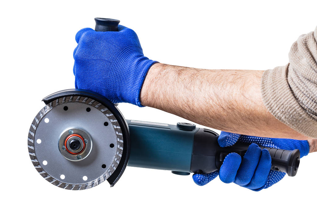 herramienta de construcción, sierra eléctrica en mano masculina
 - Foto, Imagen