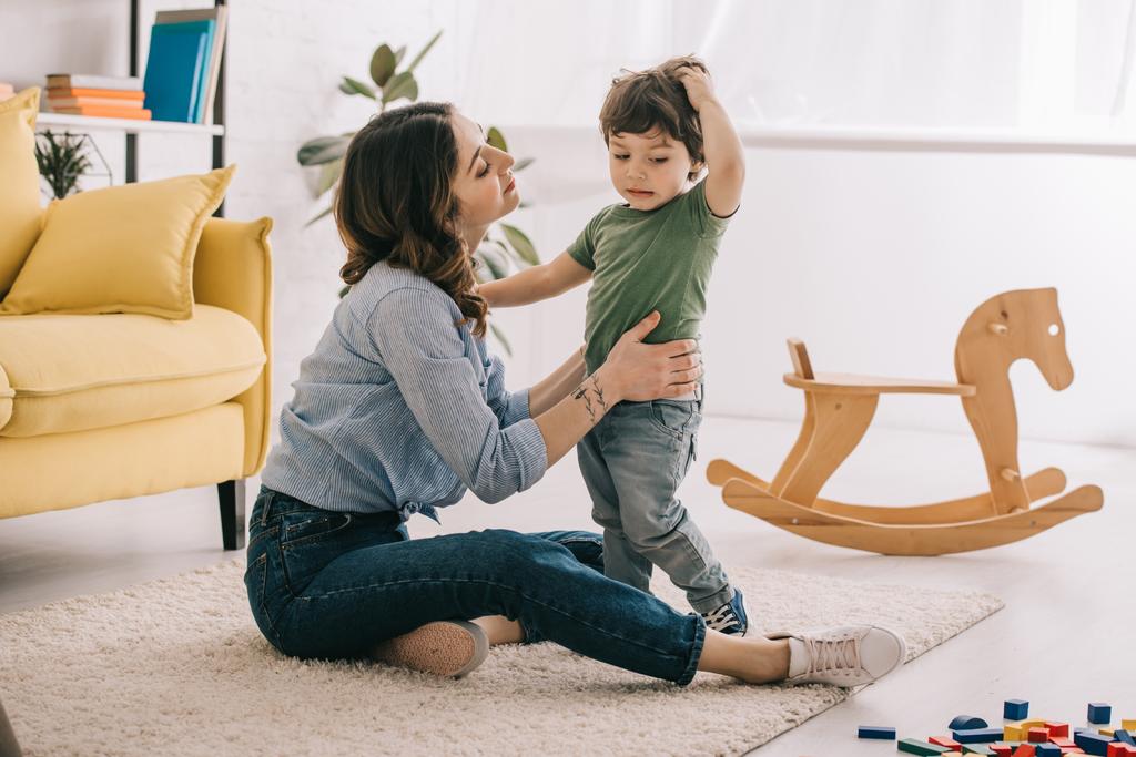 Mother and son playing together in living room - Photo, Image