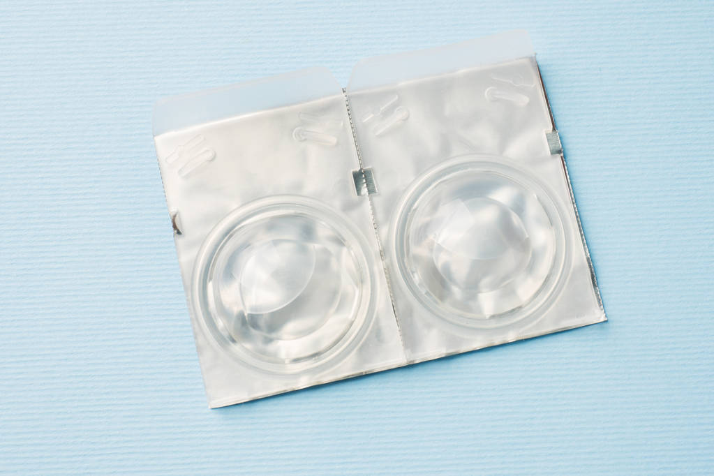 Packed contact lenses in disposable plastic containers. Close up. Selective focus. - Photo, Image