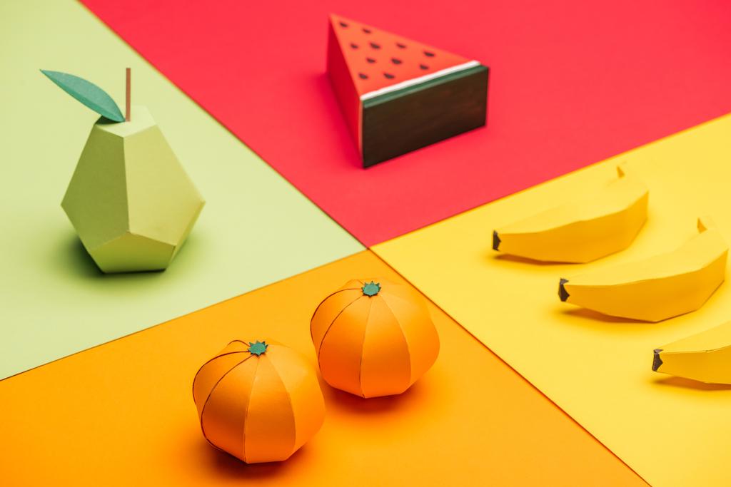 origami watermelon, pear, tangerines and bananas on colorful paper - Photo, Image