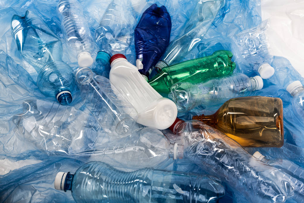 Colorful crumpled wasted bottles lying in a pile - Photo, Image