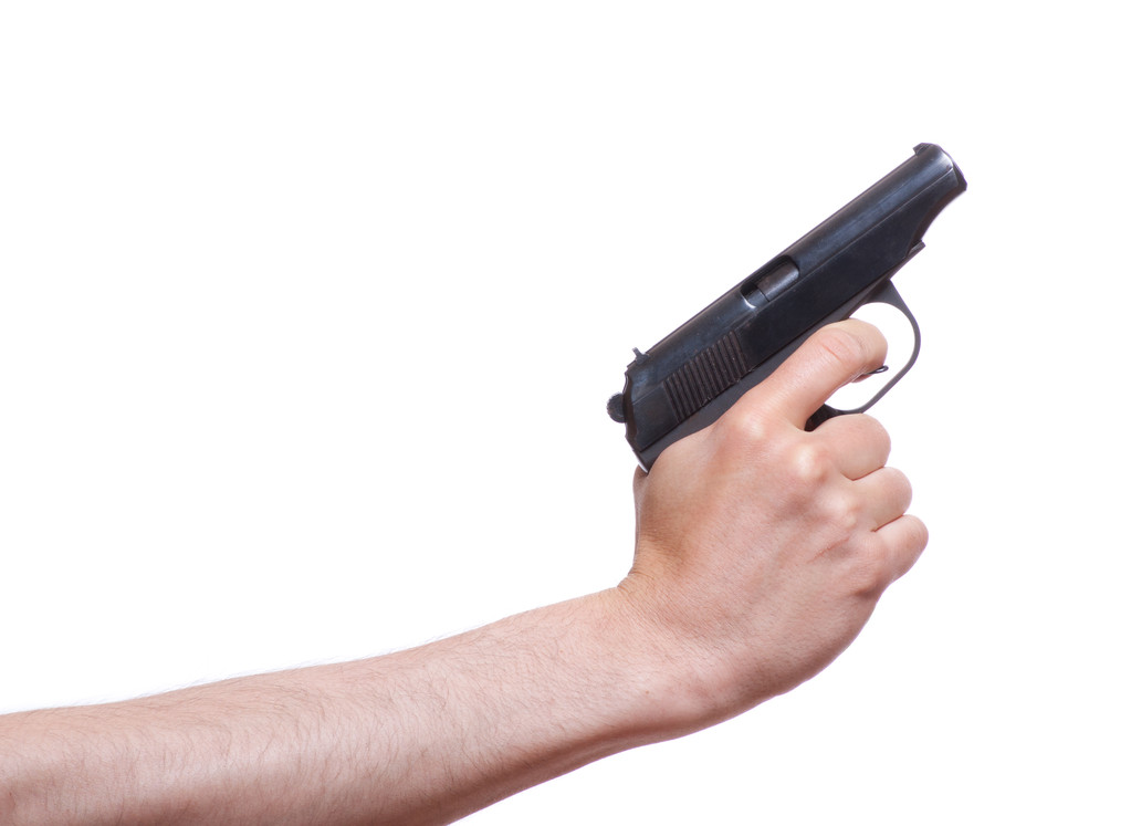 Пістолет в руці чоловіка
 - Фото, зображення