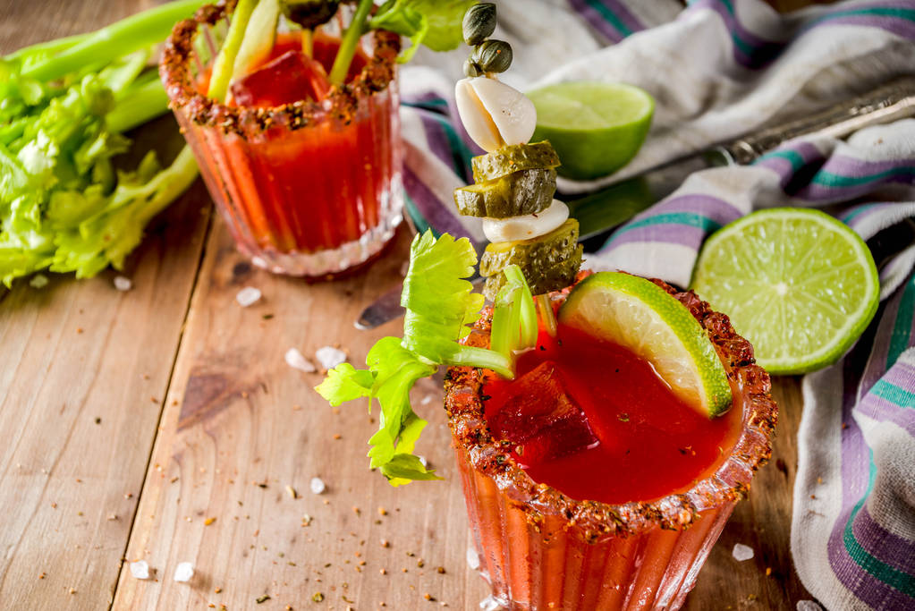 Spicy bloody mary cocktail with garnish - Photo, Image