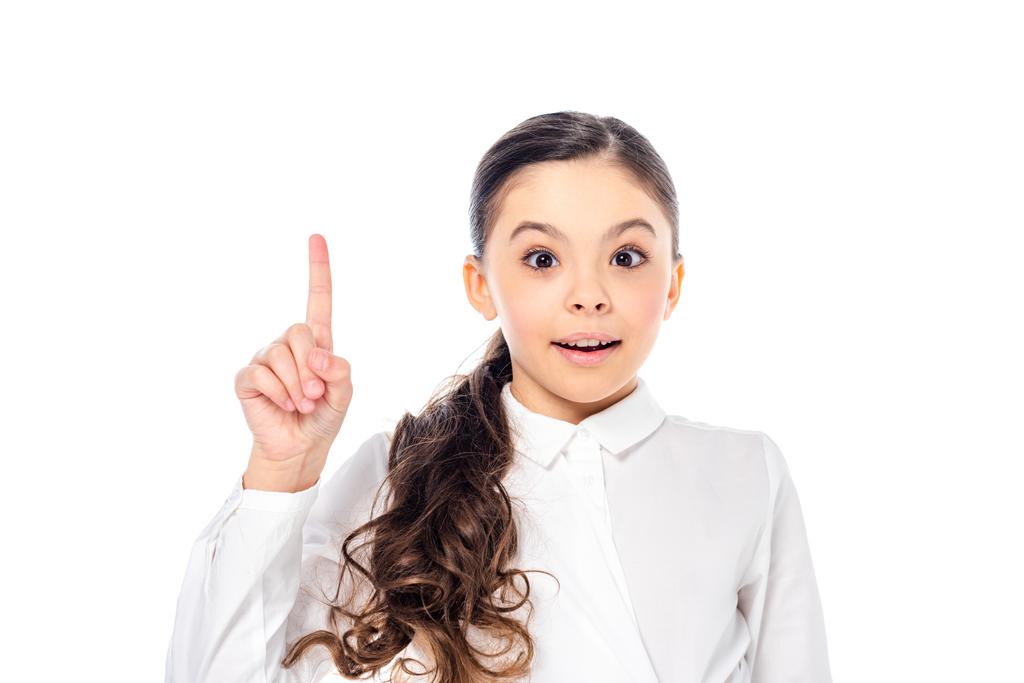 чарівна школярка в формальному одязі, що показує жест ідеї ізольовано на білому
 - Фото, зображення