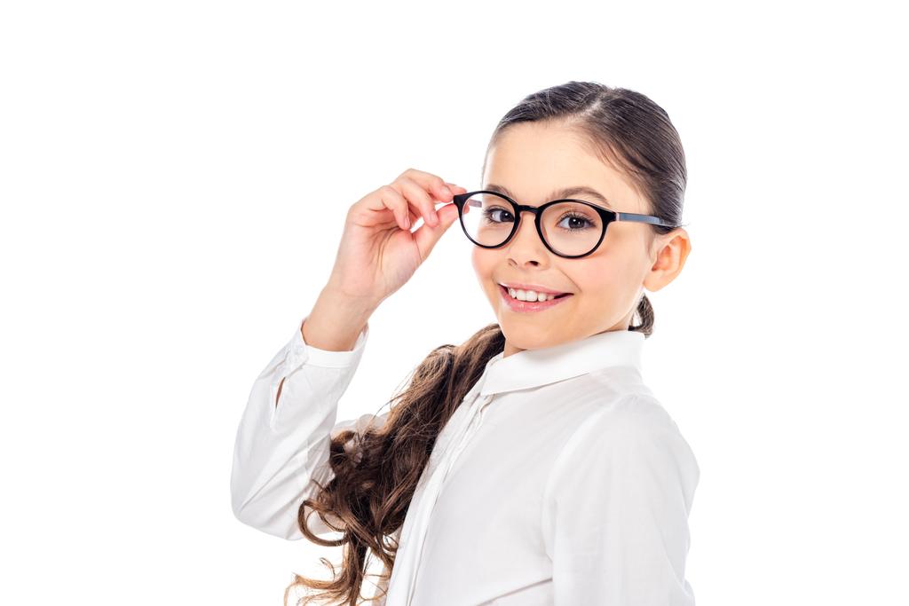 adorable schoolgirl in formal wear and glasses smiling and looking at camera Isolated On White - Photo, Image