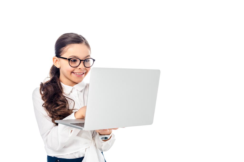 happy schoolchild in glasses using laptop Isolated On White with copy space - Photo, Image