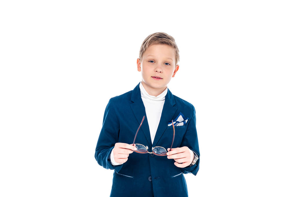 schoolboy in businessman suit holding glasses and looking at camera Isolated On White - Photo, Image