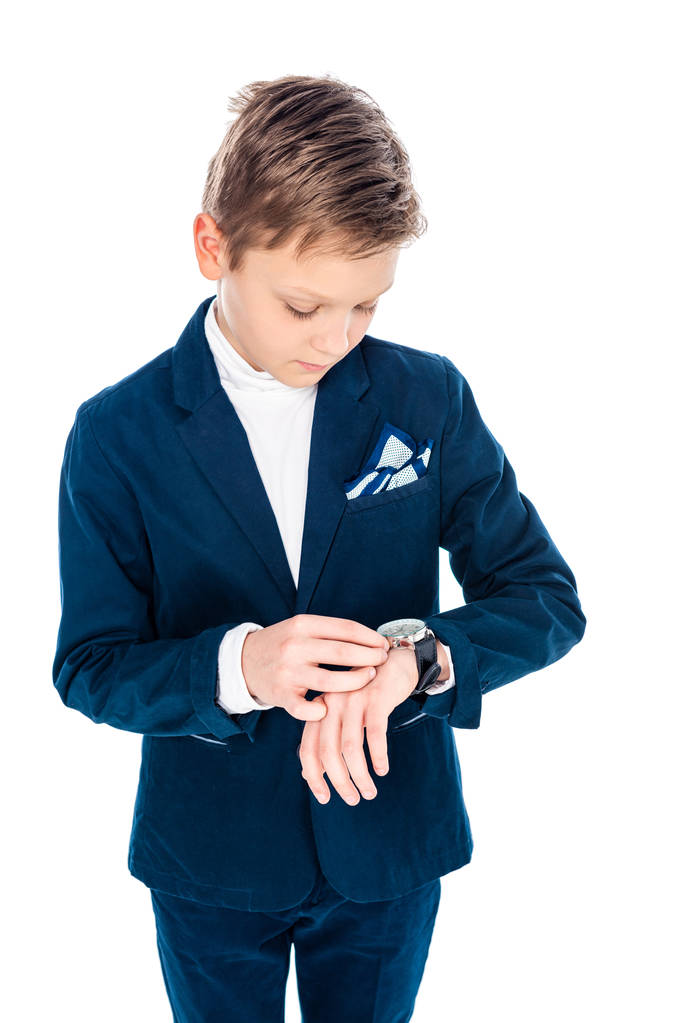 ビジネスマンのふりをしてフォーマルな服装の男子生徒は、白に孤立した時計を調整 - 写真・画像