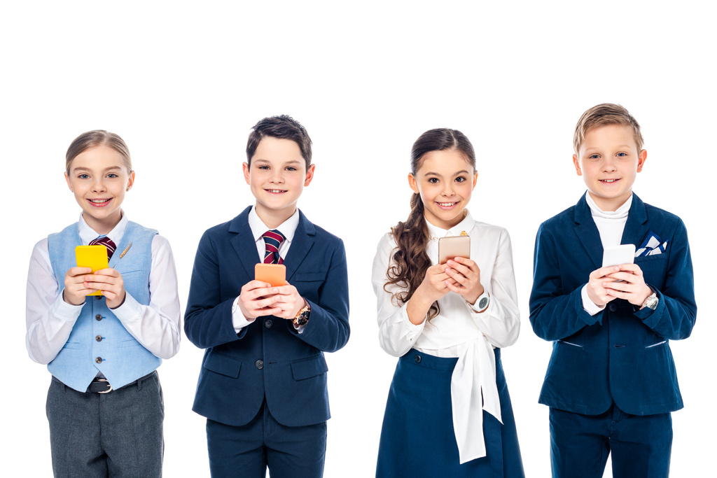 happy schoolchildren pretending to be businesspeople using smartphones Isolated On White - Photo, Image