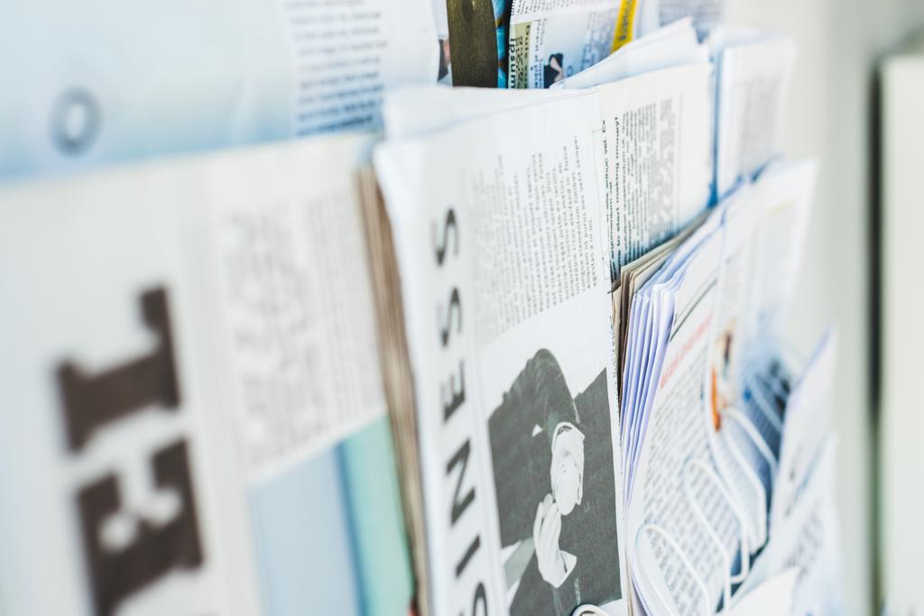 selective focus of different print newspapers on stand - Photo, Image