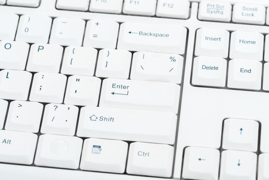 close-up de botões com símbolos no teclado branco
 - Foto, Imagem