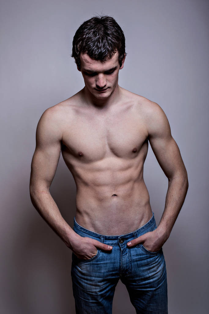 Portrait of a handsome muscular young man. Shot in a studio. - Photo, Image
