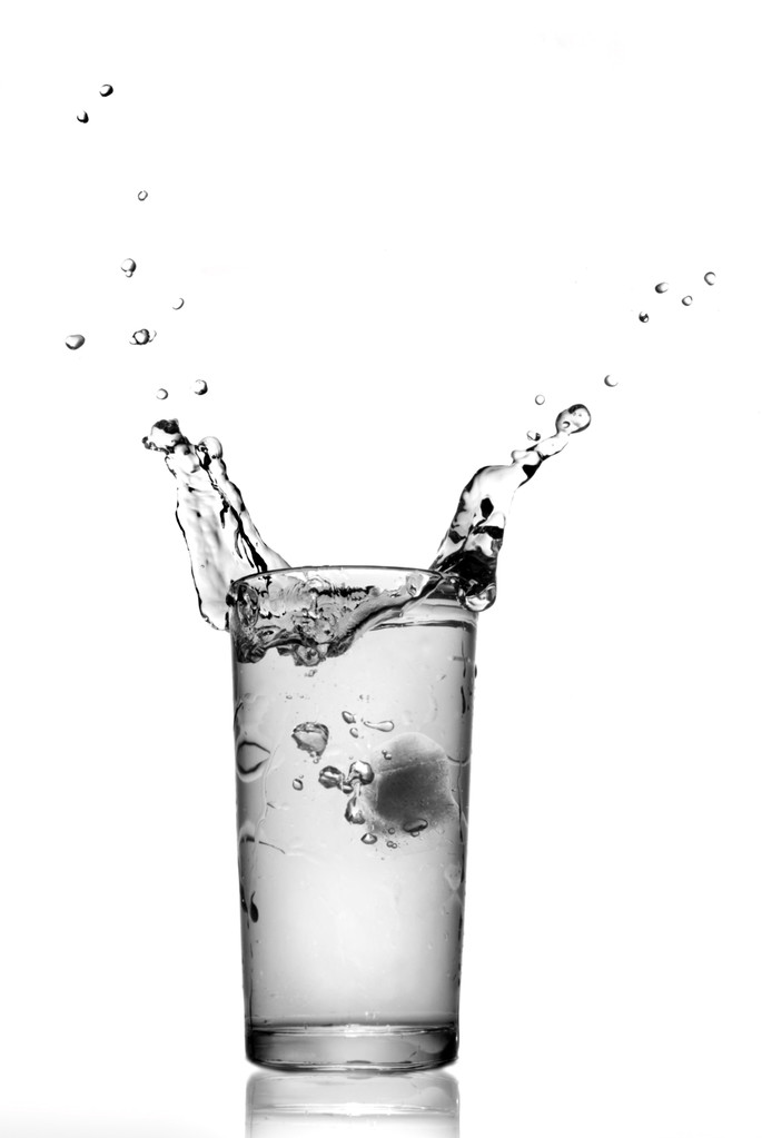 Water splash in glass isolated on white - Photo, Image